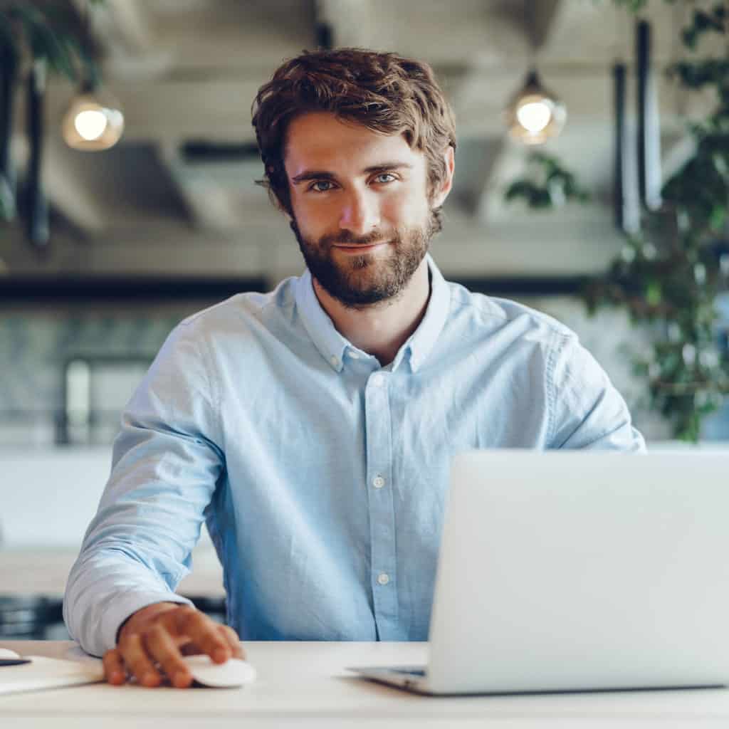 Professional working on his laptop in an office